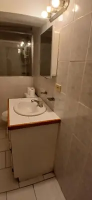 a bathroom with a sink and a mirror at Beach Front Haven, by More Than Beauty Properties in Tortola Island