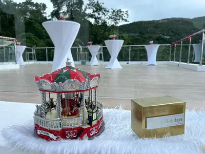 a model of a building on a table with a box at Zafira Luxe in Road Town