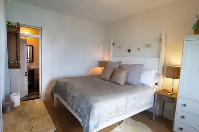 a bedroom with a large bed in a room at House of Rogues in Tortola Island