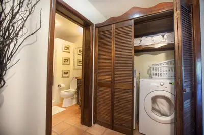 a laundry room with a washer and dryer at Endless Summer Villa in Tortola Island