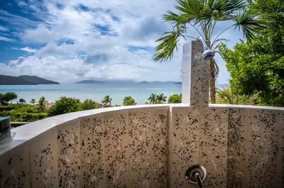 a fence with a view of the ocean at Villa ValMarc Mahoe Bay Virgin Gorda BVI in Virgin Gorda