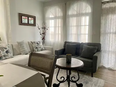a living room with a couch and a table at Abigail's Esmeralda 2 bedrom Apt in Tortola Island