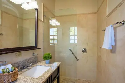 a bathroom with a sink and a shower at Bayview Vacation Apartments in Virgin Gorda