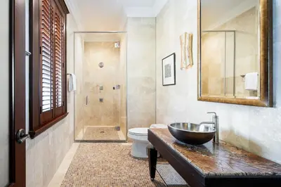 a bathroom with a sink and a toilet at Peter Island Resort in Anderson