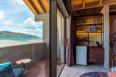 a balcony with a view of the ocean at Saba Rock Resort in Virgin Gorda